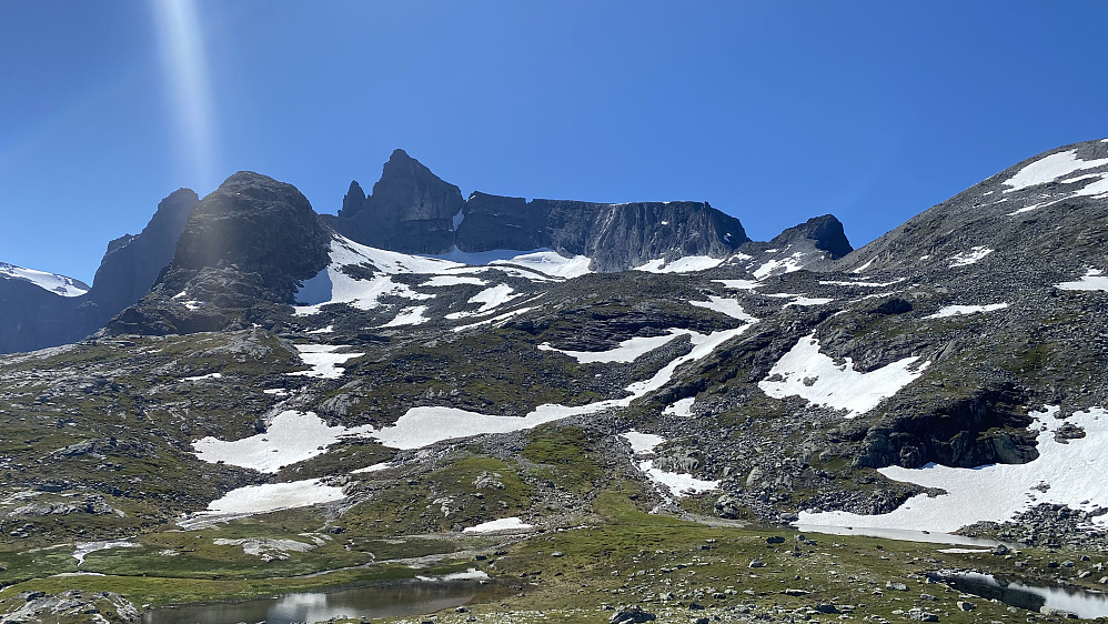 Image #1: Adelsbreen Glacier and Mount Store Trolltind as seen from Mount Norafjellet. Some snow is still seen in the chute between Mount Store Trolltind and Mount Vestre Trolltind.