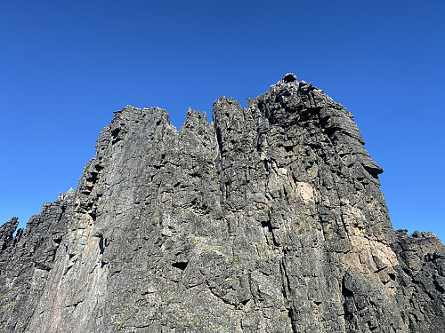 Image #21: The steep eastern wall of the notch that separates Mount Vestre Trolltinden from Mount Store Trolltinden. Rappelling down this cliff is an option if you're doing this trip in the opposite direction.