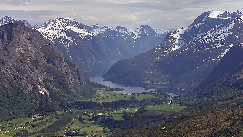 Image #11: View from Mount Jamtetinden towards Lake Eikevatnet [i.e. "The Oak Lake"] with surrounding mountains, such as Mount Goksøyra [1337 m.a.m.s.l.], Mount Fløtatinden [1711], Mount Sjøvdøla [1717] and Mount Nebba [1479].