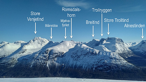 Bilde #2: Vinterbilde av Romsdalseggen og en del andre kjente Romsdals-fjell sett fra Breivikheia, på andre siden av Isfjorden.