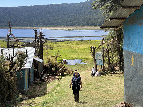 Image #11: Heading down into the crater, towards Lake Dembel. The women sitting next to the entrance are pilgrims.