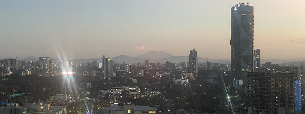 Image #23: I hadn't previously noticed, but on a bright day it may actually be possible to see Mount Zuqualla even from Addis Abeba. Here from the rooftop restaurant of the Monark Park View Hotel one night later; and Zuqualla is the mountain seen right there in the middle of the picture.