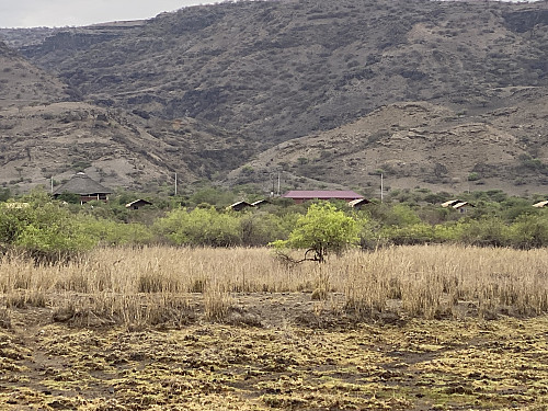 Image #15: Almost back at our lodge. The rounded and larger building close to the left edge of the picture, is the combined restaurant and reception of the hotel.