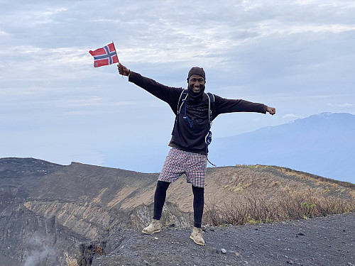 Image #26: Frank with the Norwegian flag on the rim of the crater.
