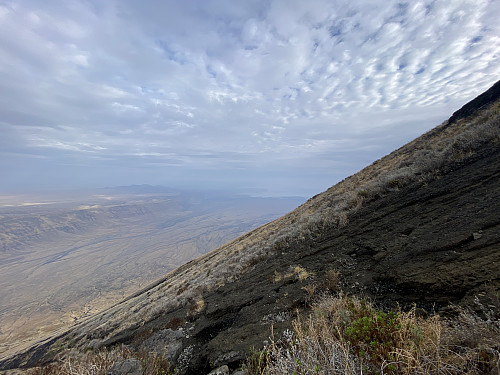Image #36: A view towards the north, with Lake Natron in the distance. The valley seen is part of the Gregory branch of the East African Rift System, and the "endless cliff" along the west side of the valley, is the one lining the western boundary of the rift.