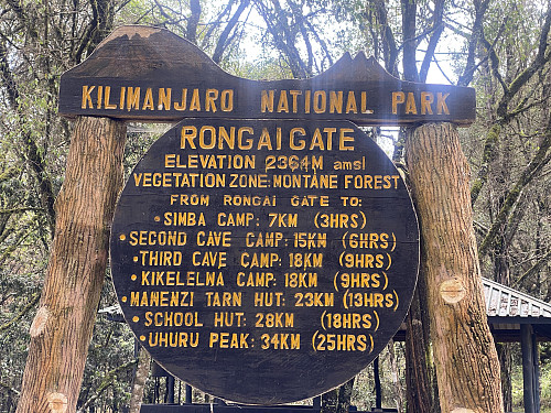 Image #3: The information sign at the New Rongai Gate. Our plan was to follow the route up to the Mawenzi Tarn Hut, and spend one night at the Simba Camp and another at the Kikelewa Camp Site on our way up there.
