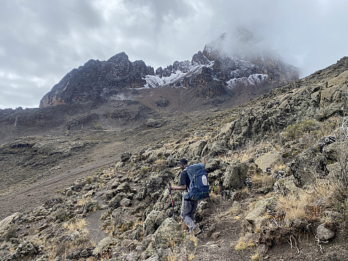 Image #23: Holson on the trail, as we were approaching the Mawenzi Tarn Hut. Mawenzi is seen in the background of the picture, but the summit can't be seen from this angle.