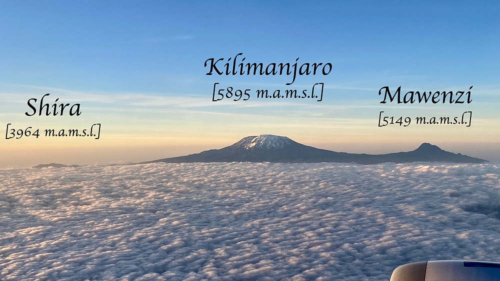 Image #1: Mount Kilimanjaro as seen from Ethiopian Airlines flight ET814 an evening in June 2022, right after a stopover at Kilimanjaro airport, while on my way home from Zanzibar. The image shows the three volcanic cones of the mountain, though Shira is barely seen as it almost disappears in the clouds.