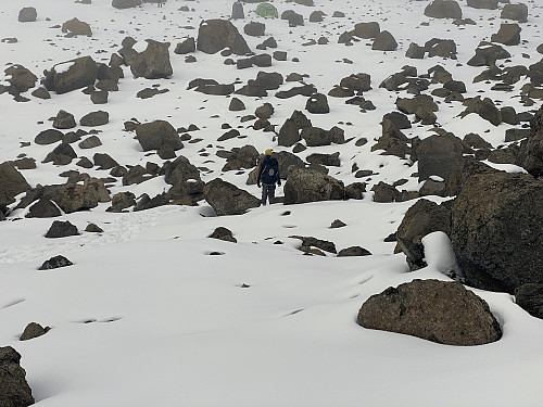 Image #55: Approaching the bottom of the valley. The Crater Camp site, with a green and a blue tent, is seen just at the upper edge of the image.