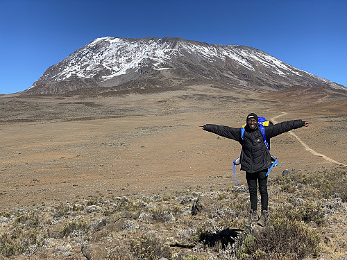 Image #65: Frank posing in front of Kilimanjaro, on our way down towards Horombo.