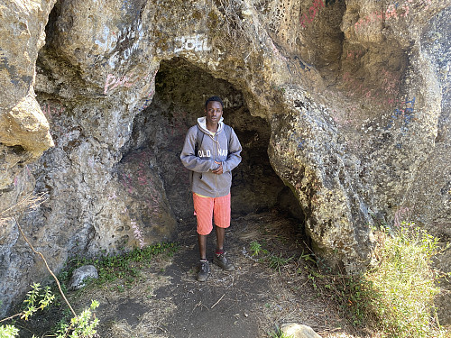 Image #21: Samwel at the lower cave of Mount Hanang.