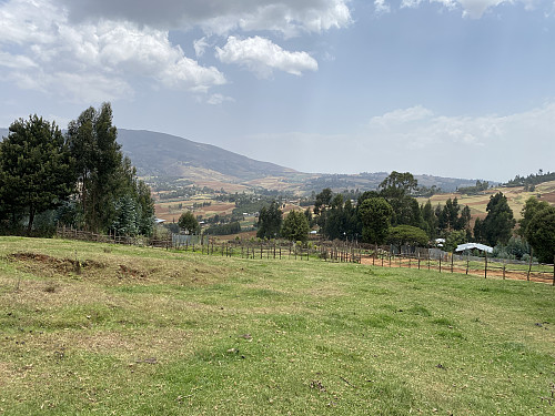 Image #7: Passing some small villages on our way down into the saddle shaped valley between Jemo and Wochecha.