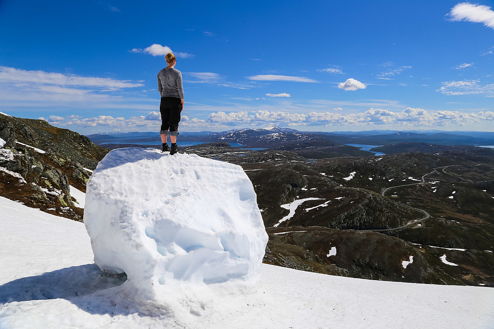 Kristin on a big ball of snow.