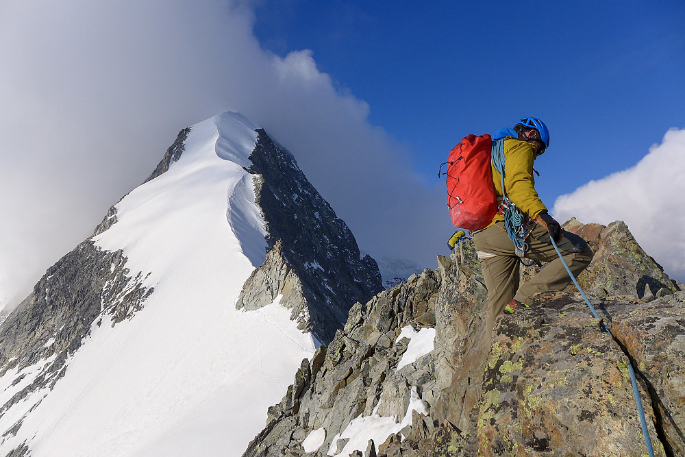 The Biancograt emerges from behind the rock ridge