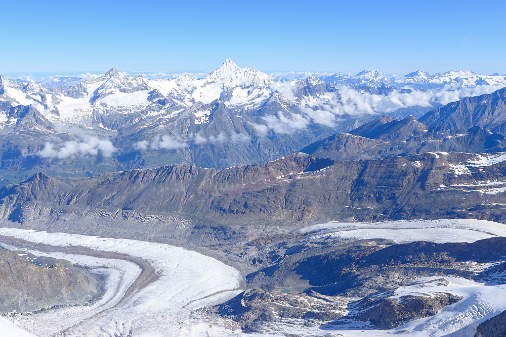 View down the Grenzgletscher with the Weisshorn towering above in the distance