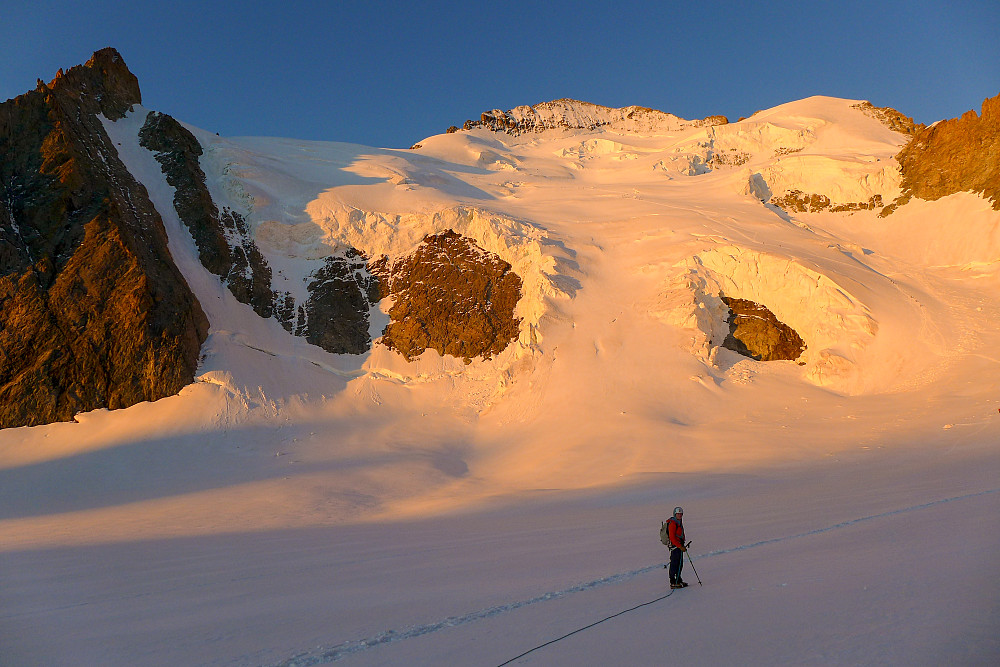 Sunrise on the face with the Barre Noir couloir at the left