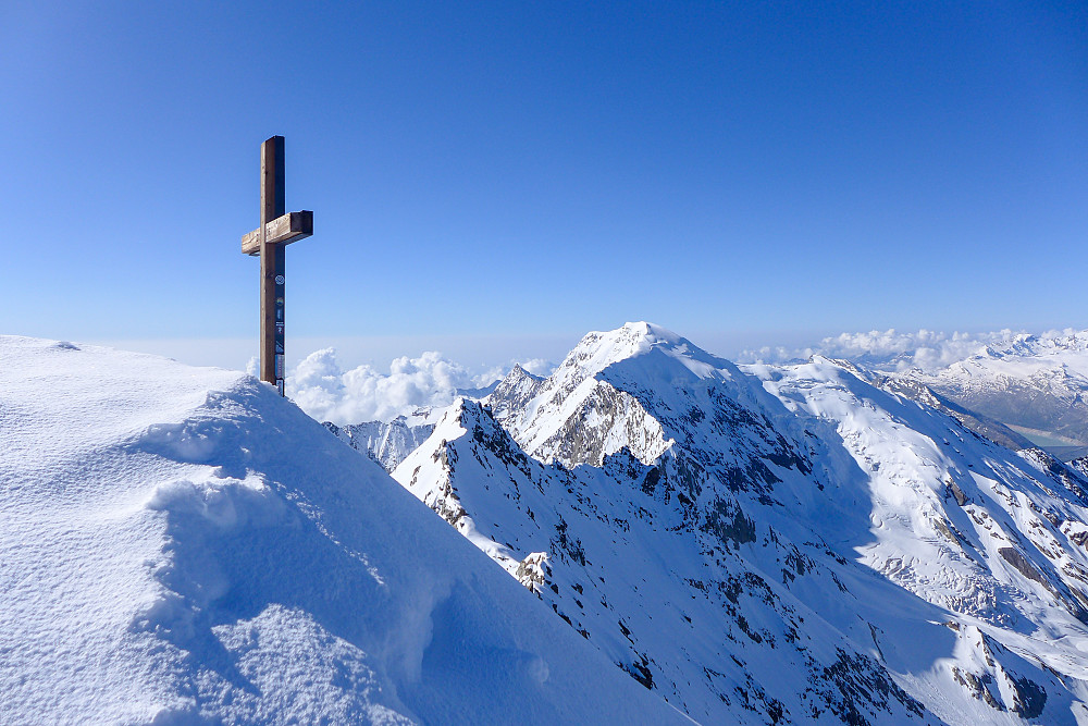 The Lagginhorn summit cross with the Weissmies behind