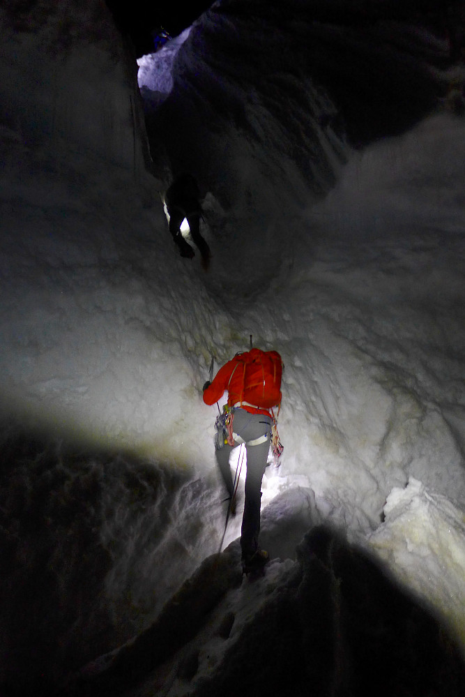 Tim climbing over the bergschrund at the foot of the Whymper couloir