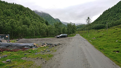 Parked at a gravel-covered area next to the road