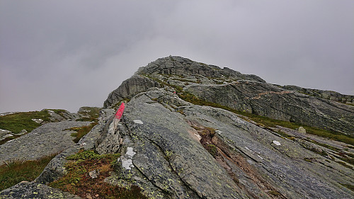 The final easy scrambling section to reach the summit cairn