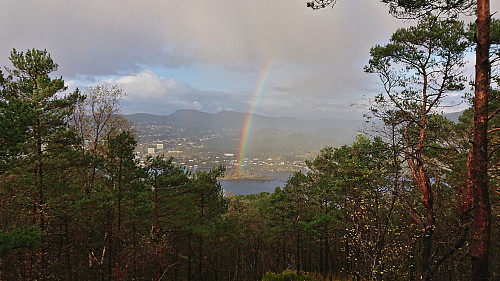 Rainbow ending at Storøya in Eidsvågen with Høgstefjellet and Veten in the background