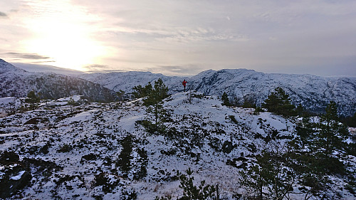 Petter at the summit of Gaddane with Storafjellet and Grytingsfjellet in the background