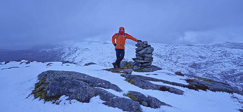 Endre at a cairn on a hill around 180 meters east of the highest point