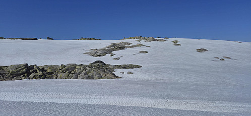 The summit cairn appearing